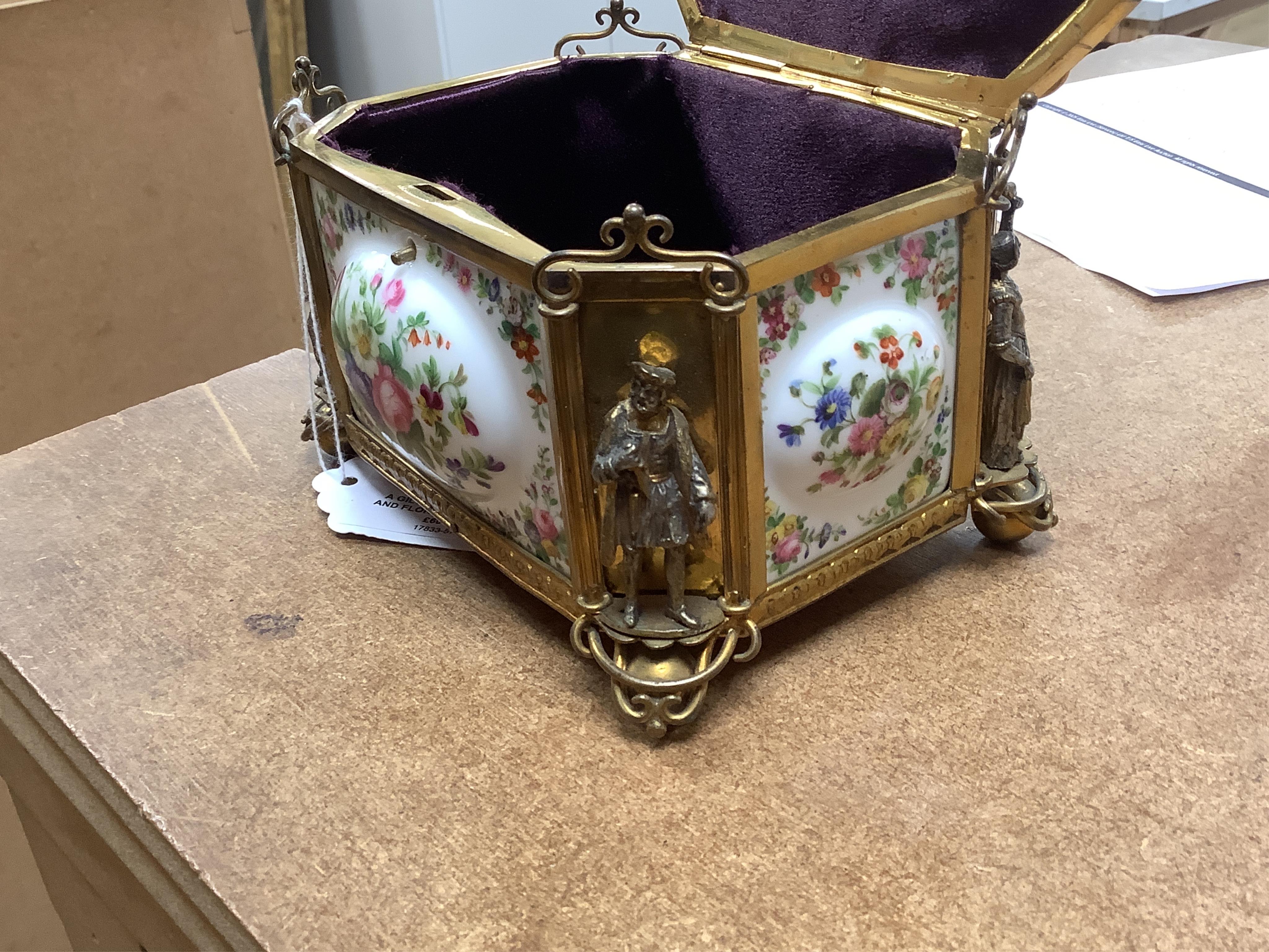 A gilt-brass figural and floral porcelain jewellery casket, 14cm wide, 11cm high.